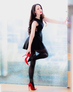 Vanessa Pur - black nylons and a short black dress
