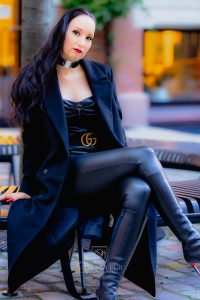 Vanessa Pur - black leather catsuit - boots - coat