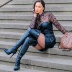 Vanessa Pur in leather boots and OTK boots, leather dress and a white coat in Berlin